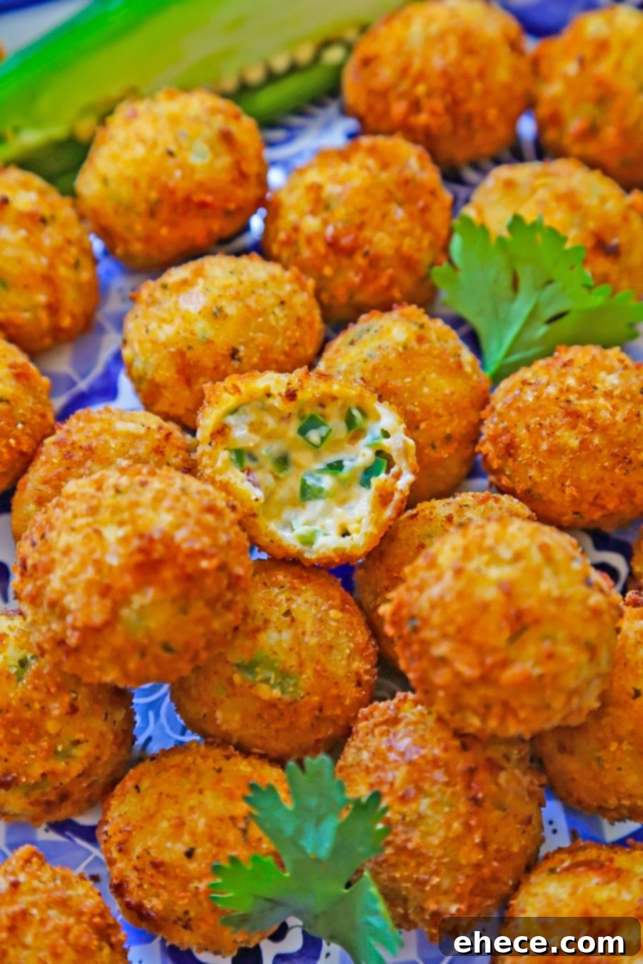 A tray of uncooked Jalapeño Popper Bites, ready for frying, showcasing their uniform shape.
