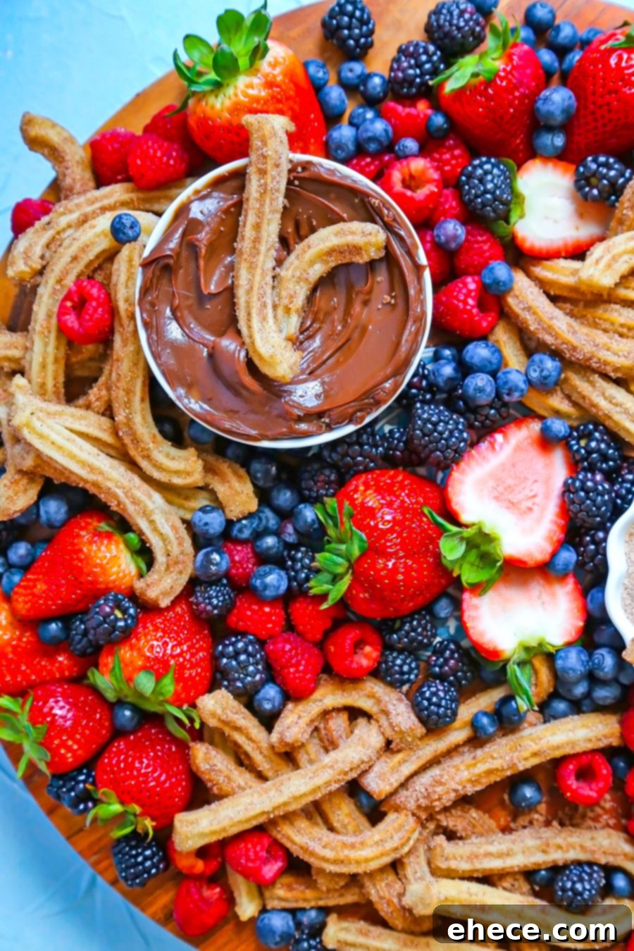 Close-up of the Churro and Berry Dessert Board, highlighting the texture of the churros and the freshness of the berries.