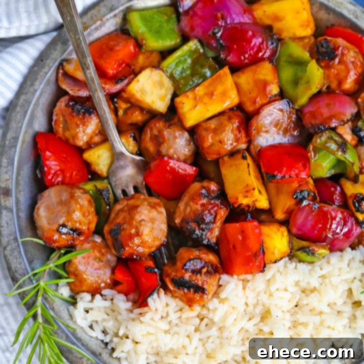 BBQ Sausage, Veggie + Pineapple Skewers on a serving platter