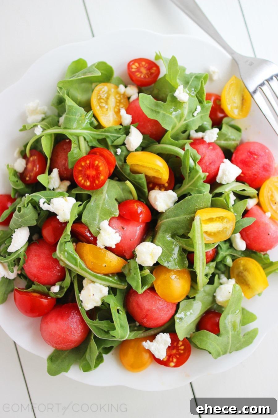 Juicy Watermelon, Tangy Feta, Peppery Arugula: A Zesty Summer Salad 2 Vibrant Watermelon Feta Arugula Salad with Honey-Lemon Vinaigrette, perfect for summer.