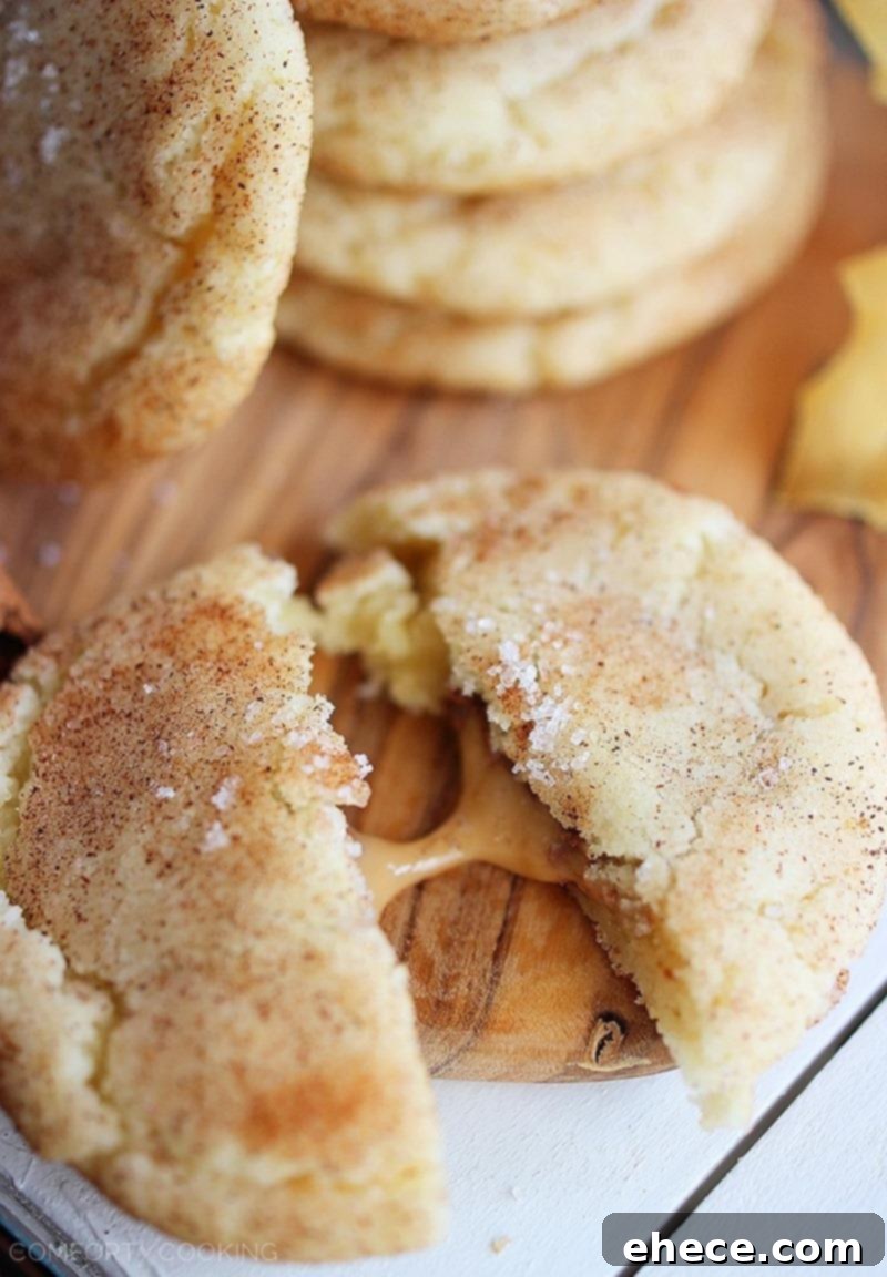 Sea Salt Caramel Snickerdoodle Pockets 3 Several freshly baked Sea Salt Caramel Stuffed Snickerdoodles cooling on a wire rack, highlighting their golden edges and soft centers.