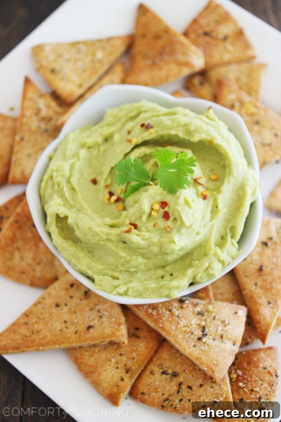 Avocado Hummus + Whole Wheat Pita Chips – Smooth, creamy white bean avocado hummus and homemade pita chips make this the perfect party snack!