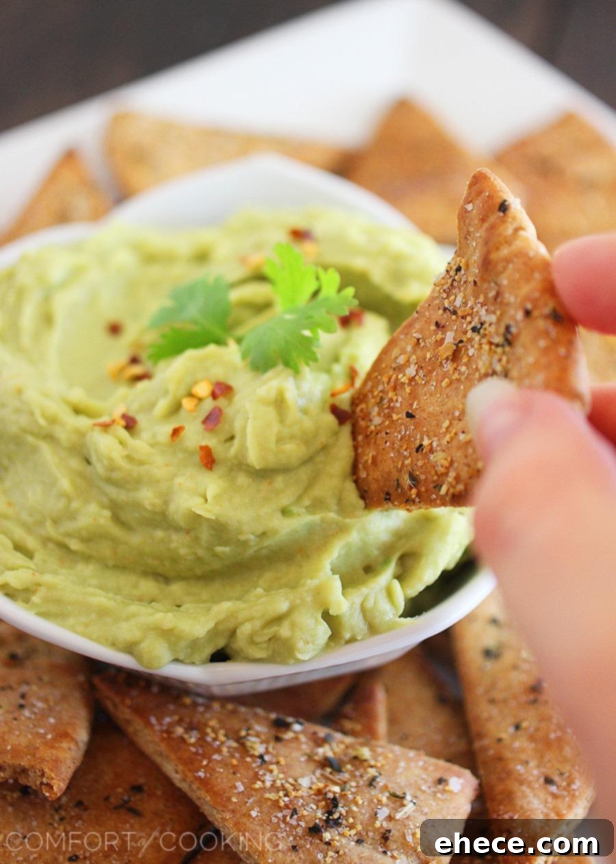 Avocado Hummus + Whole Wheat Pita Chips – Smooth, creamy white bean avocado hummus and homemade pita chips make this the perfect party snack!