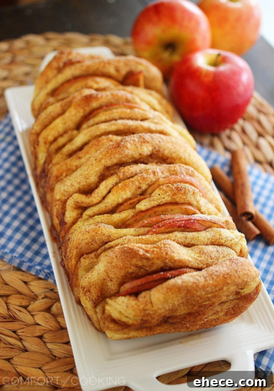 Apple Pie Pull Apart Bread with Vanilla Glaze – Soft layers of cinnamon-sugar biscuit dough and fresh apple slices combine in this amazing pull apart bread!