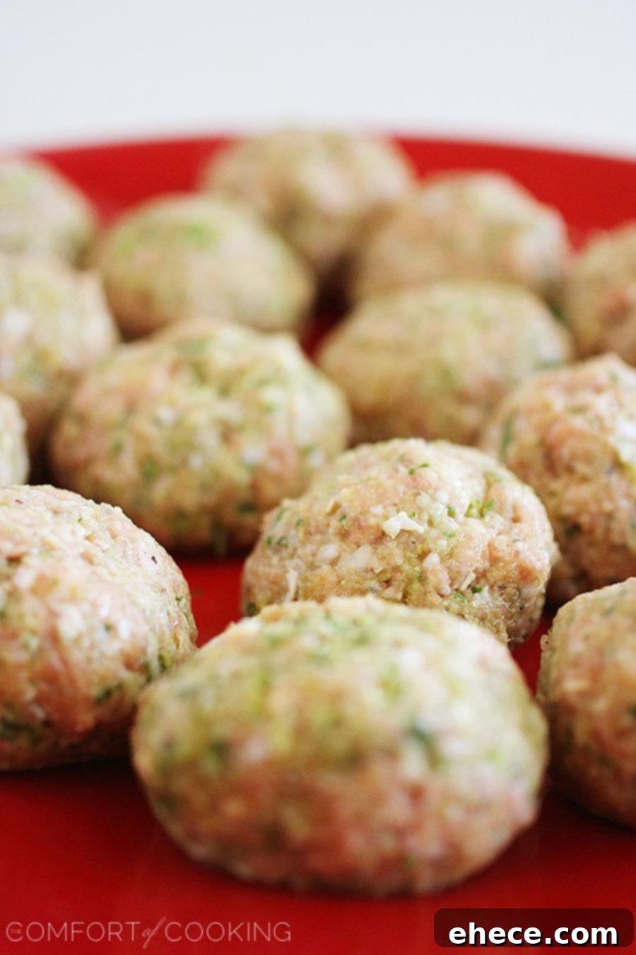 A bowl of Slow Cooker Turkey Pesto Meatballs served with pasta