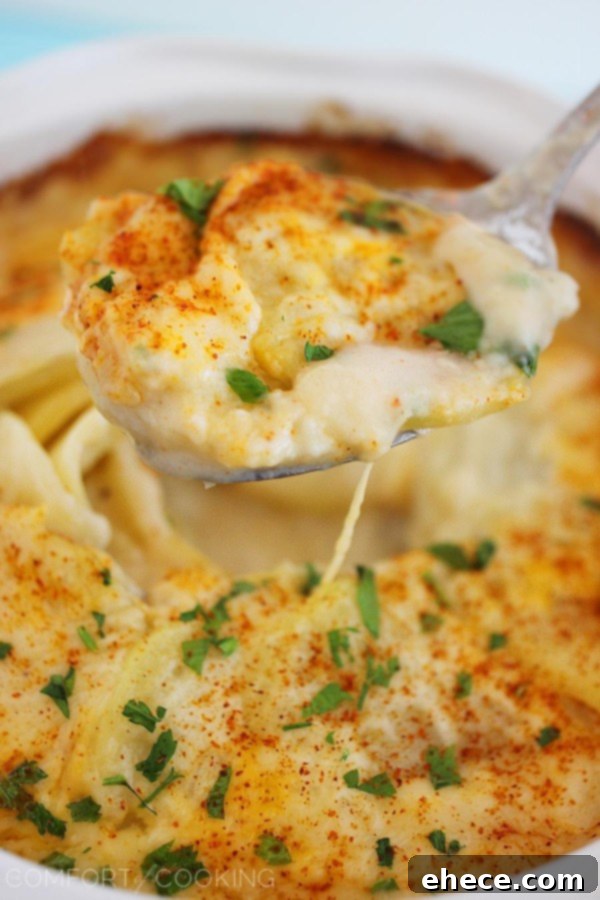 Cheesy Scalloped Potato Gratin – Creamy, buttery scalloped potatoes are the true definition of comfort food. Perfect for weeknights or holiday feasts! | thecomfortofcooking.com