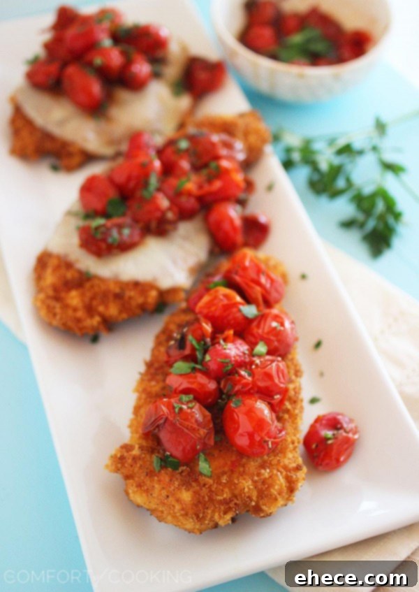 Crispy Parmesan Chicken Cutlets topped with Sweet Balsamic Roasted Tomatoes