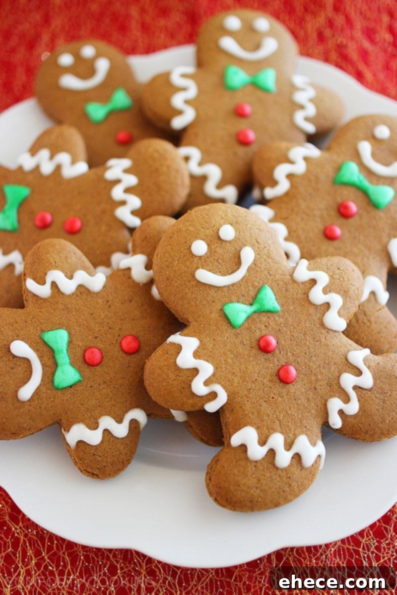 A festive array of decorated gingerbread man cookies on a platter.