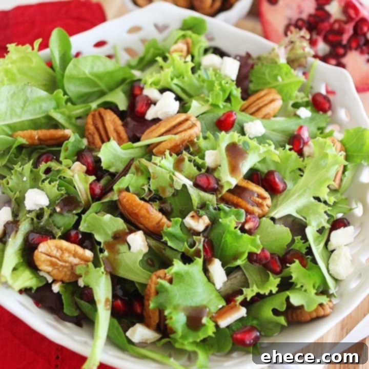 Jeweled Greens with Feta and Pecans 7 Mixed Green Salad with Pomegranate Seeds, Feta and Pecans - The ultimate light and colorful holiday side dish!