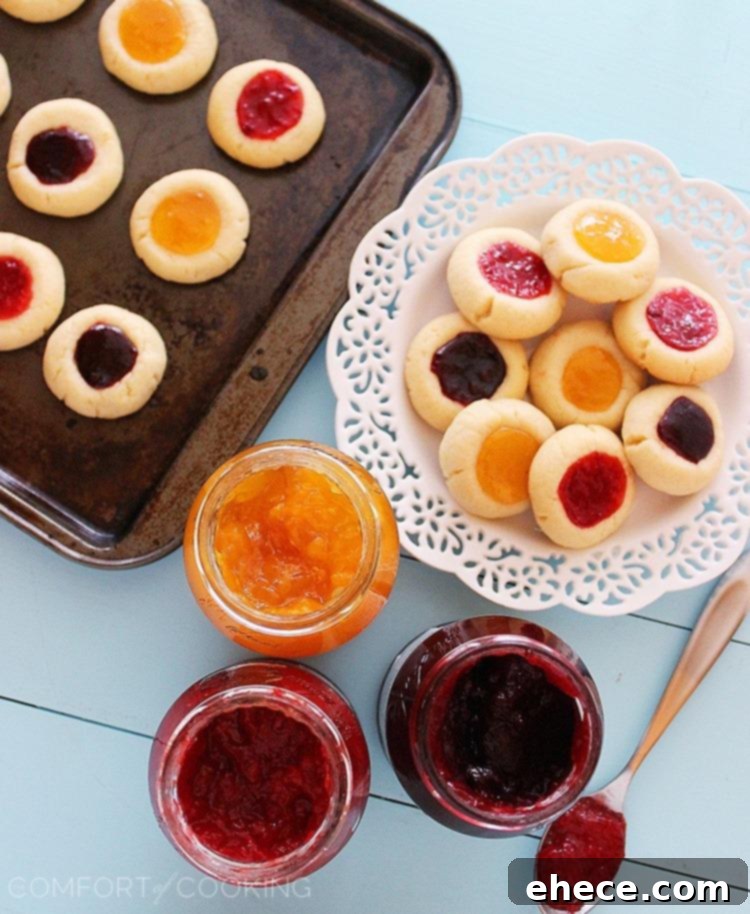 Jammy Thumbprint Gems 4 Warm jam thumbprint cookies cooling on a rack