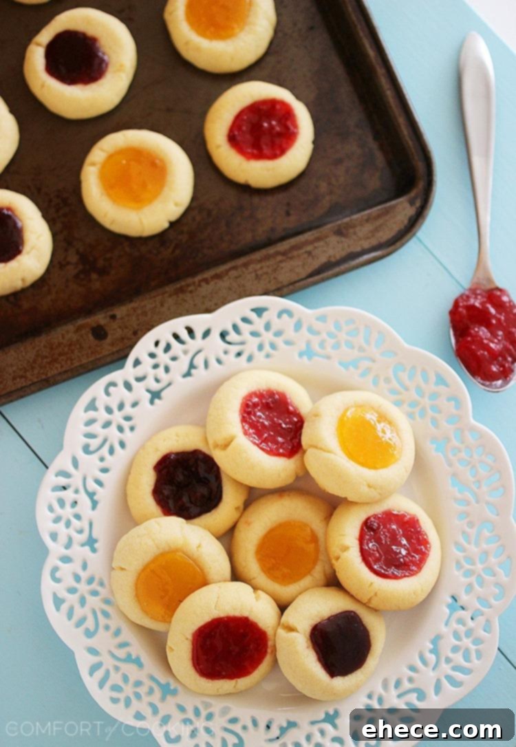 Jammy Thumbprint Gems 5 A plate of colorful jam thumbprint cookies