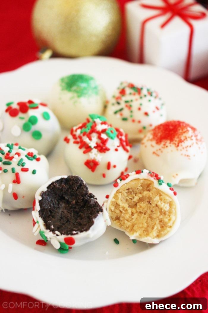 Effortless Oreo Truffle Bites 4 No-Bake Oreo Truffles – Stack of homemade no-bake Oreo truffles with white chocolate coating and various sprinkles, showing their appealing texture and festive look.