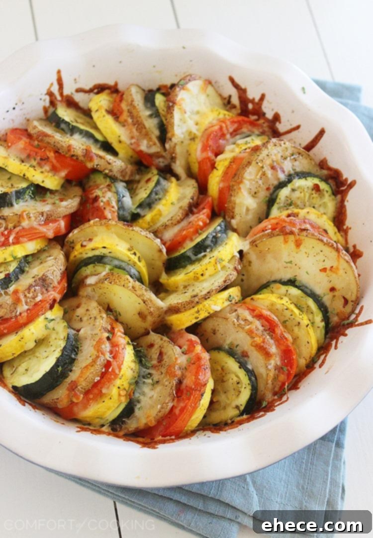 Golden Baked Parmesan Vegetable Tian 2 Parmesan Vegetable Tian – Our all-time favorite side dish! Layered potatoes, zucchini, tomatoes and squash, baked 'til tender & crisp with a cheesy Parmesan topping. Healthy, colorful and delicious on the side of roasted meats! | thecomfortofcooking.com