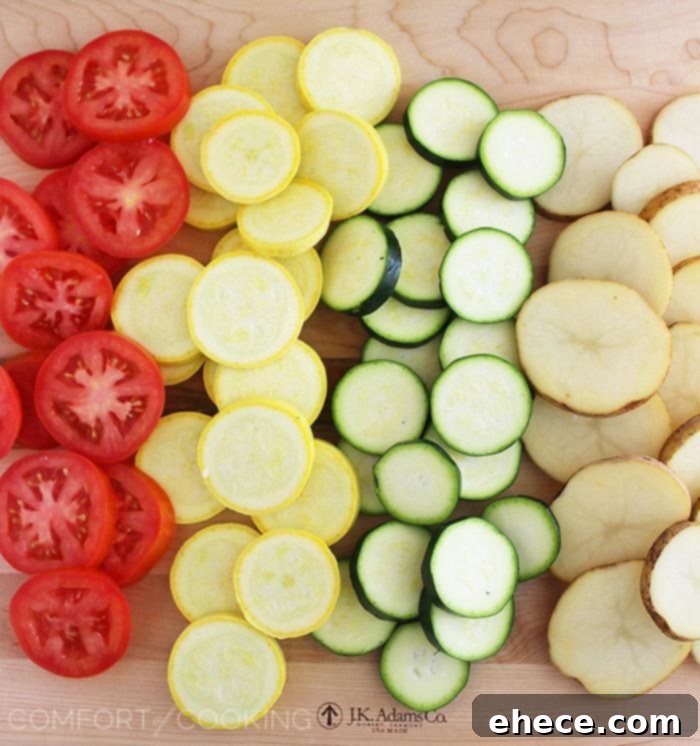 Golden Baked Parmesan Vegetable Tian 3 Parmesan Vegetable Tian – Our all-time favorite side dish! Layered potatoes, zucchini, tomatoes and squash, baked 'til tender & crisp with a cheesy Parmesan topping. Healthy, colorful and delicious on the side of roasted meats! | thecomfortofcooking.com