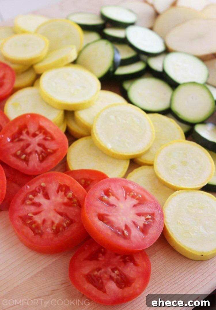 Golden Baked Parmesan Vegetable Tian 4 Parmesan Vegetable Tian – Our all-time favorite side dish! Layered potatoes, zucchini, tomatoes and squash, baked 'til tender & crisp with a cheesy Parmesan topping. Healthy, colorful and delicious on the side of roasted meats! | thecomfortofcooking.com