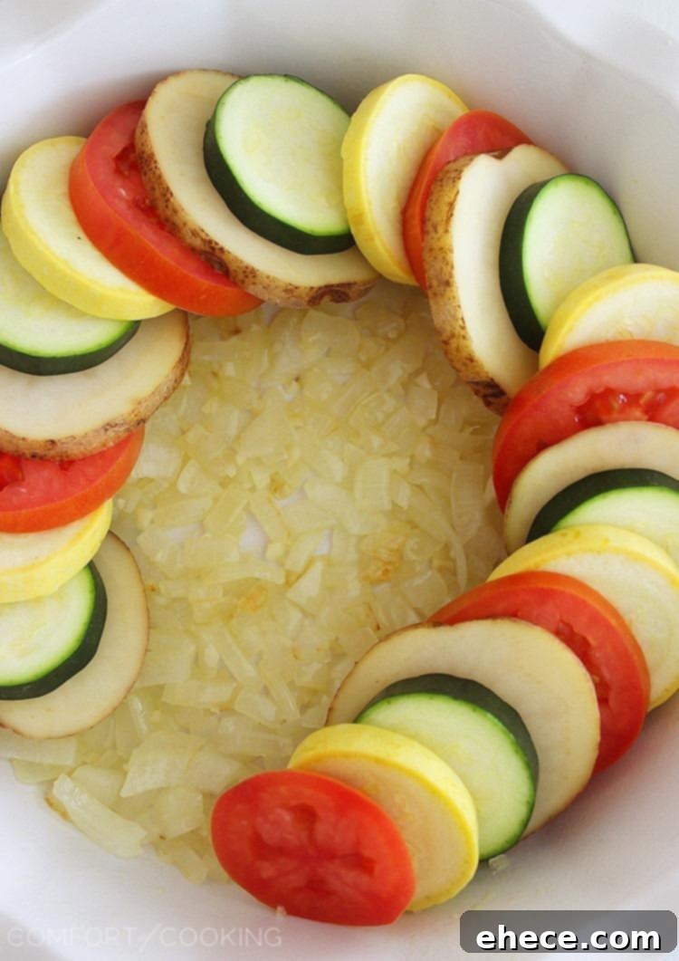 Golden Baked Parmesan Vegetable Tian 5 Parmesan Vegetable Tian – Our all-time favorite side dish! Layered potatoes, zucchini, tomatoes and squash, baked 'til tender & crisp with a cheesy Parmesan topping. Healthy, colorful and delicious on the side of roasted meats! | thecomfortofcooking.com