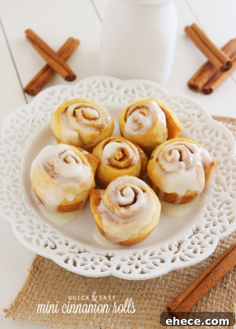 Quick & Easy Mini Cinnamon Rolls – Super soft, quick and easy crescent cinnamon rolls with vanilla glaze! No rise (or fuss) required. Make them this weekend! | thecomfortofcooking.com