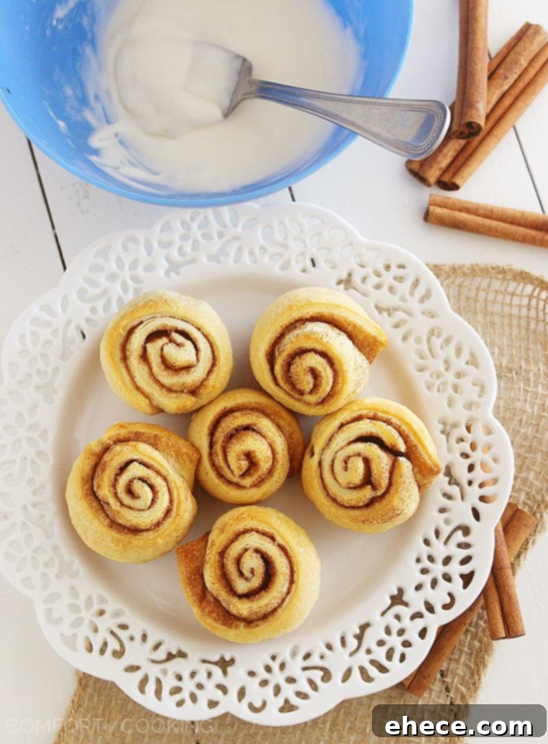 Quick & Easy Mini Cinnamon Rolls – Super soft, quick and easy crescent cinnamon rolls with vanilla glaze! No rise (or fuss) required. Make them this weekend! | thecomfortofcooking.com