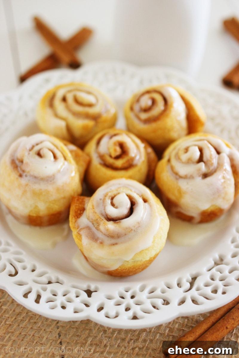 Quick & Easy Mini Cinnamon Rolls – Super soft, quick and easy crescent cinnamon rolls with vanilla glaze! No rise (or fuss) required. Make them this weekend! | thecomfortofcooking.com