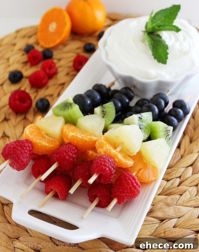 Rainbow Fruit Skewers with Vanilla-Honey Yogurt Dip – Fresh and colorful fruit skewers with a creamy honey-vanilla yogurt dip are perfect for healthy snacking and parties! | thecomfortofcooking.com