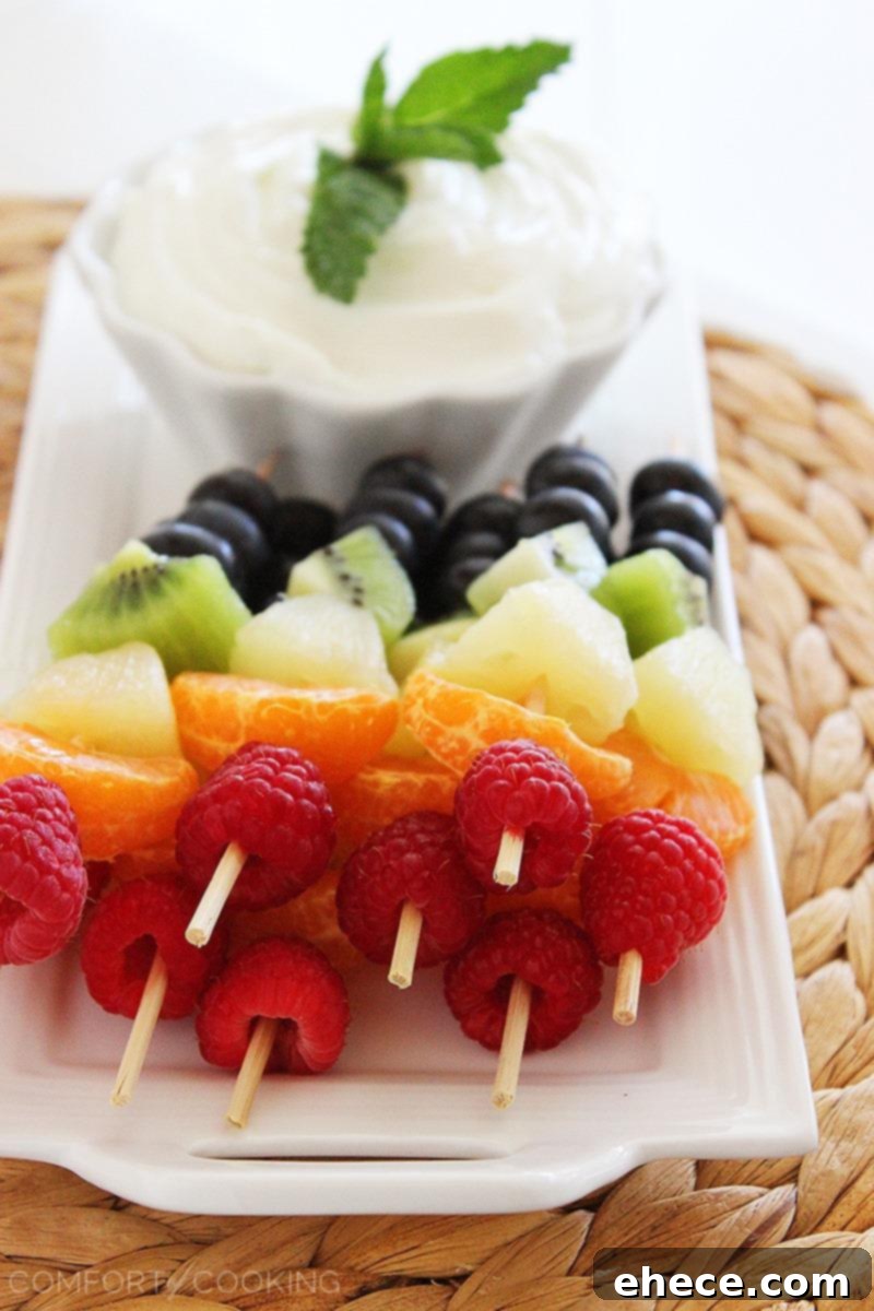 Rainbow Fruit Skewers with Vanilla-Honey Yogurt Dip – Fresh and colorful fruit skewers with a creamy honey-vanilla yogurt dip are perfect for healthy snacking and parties! | thecomfortofcooking.com