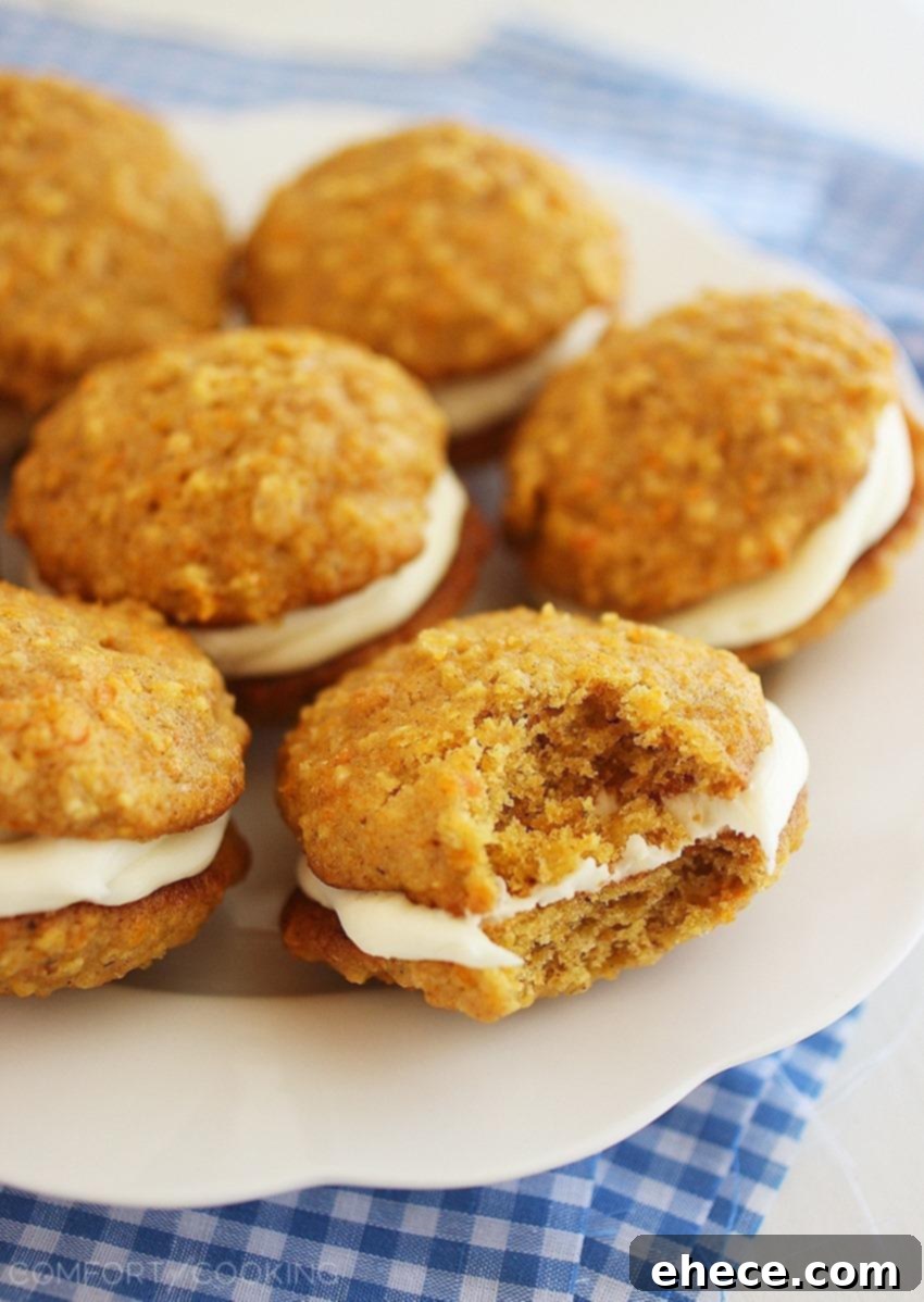 Closeup of a Stack of Soft Carrot Cake Sandwich Cookies, showcasing their creamy filling and delicious texture. An ideal treat for spring celebrations.