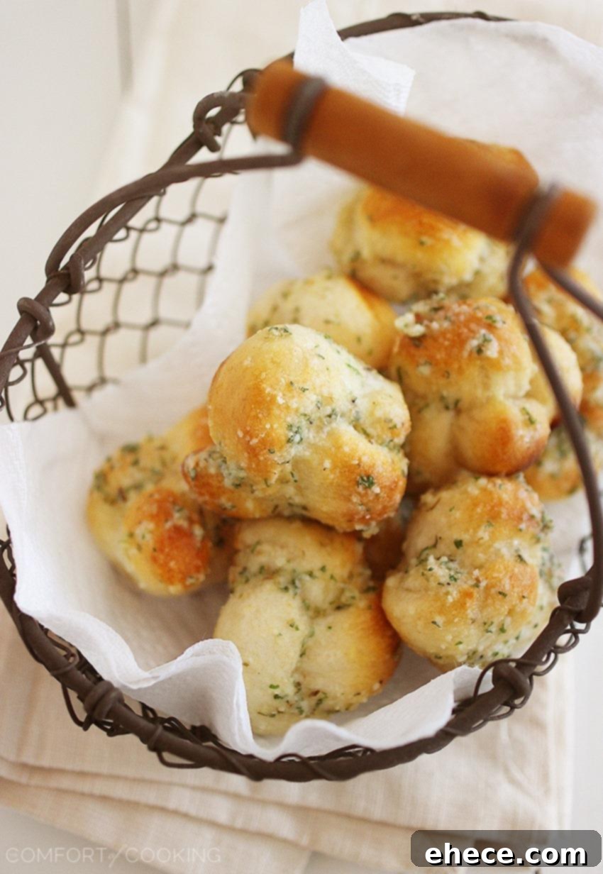 Quick & Easy Garlic Parmesan Knots – Fluffy soft, delicious garlic knots made in 10 minutes - just 3 ingredients (plus some spices) and no rising required. So easy! | thecomfortofcooking.com