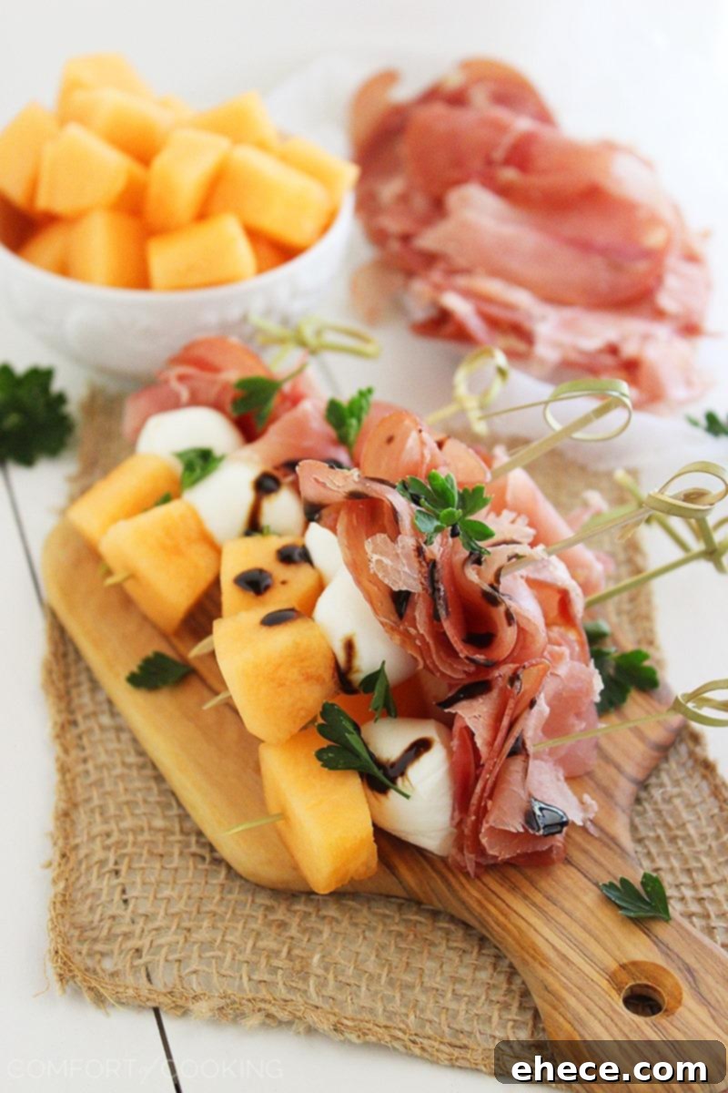 Delicious Melon, Prosciutto, and Mozzarella Skewers, perfect for a spring party appetizer. Fresh and easy sweet and salty bites. | thecomfortofcooking.com
