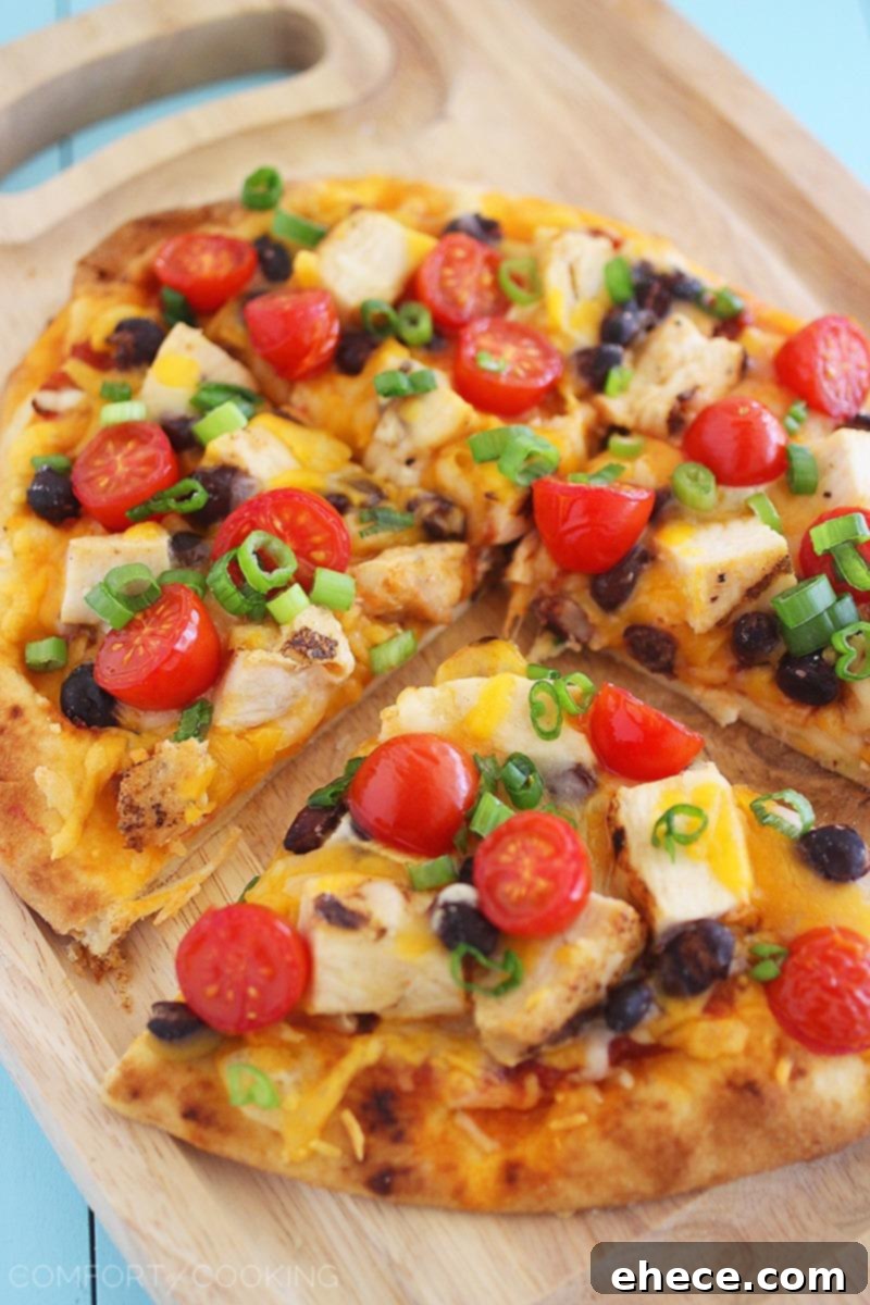 Tex-Mex Chicken Taco Flatbread – This easy, cheesy flatbread makes for a scrumptious and quick dinner or lunch with Southwestern flair!