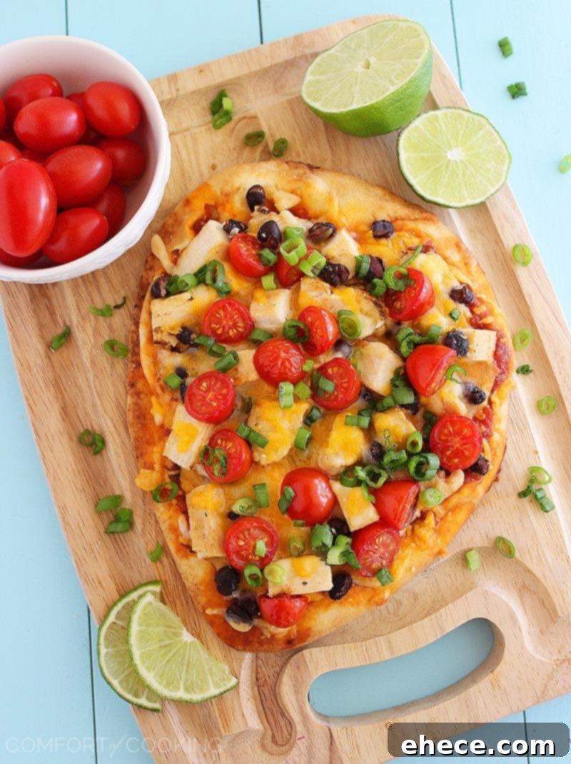 Tex-Mex Chicken Taco Flatbread – This easy, cheesy flatbread makes for a scrumptious and quick dinner or lunch with Southwestern flair!