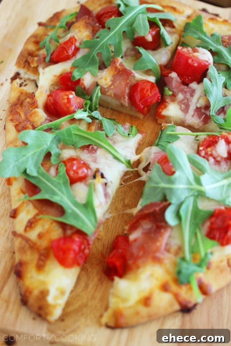 Serving slices of homemade Naan Pizza