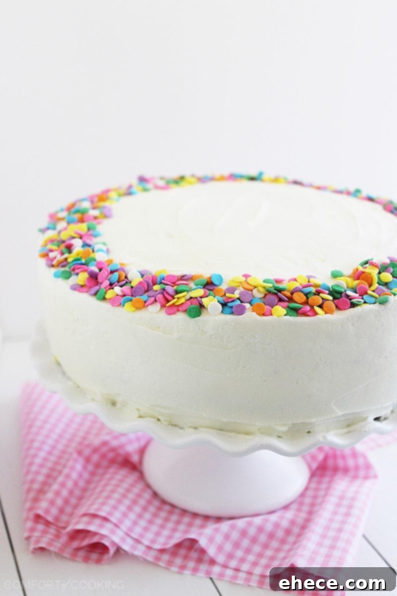 Exquisite Yellow Birthday Cake with Velvety Vanilla Frosting and Sprinkles