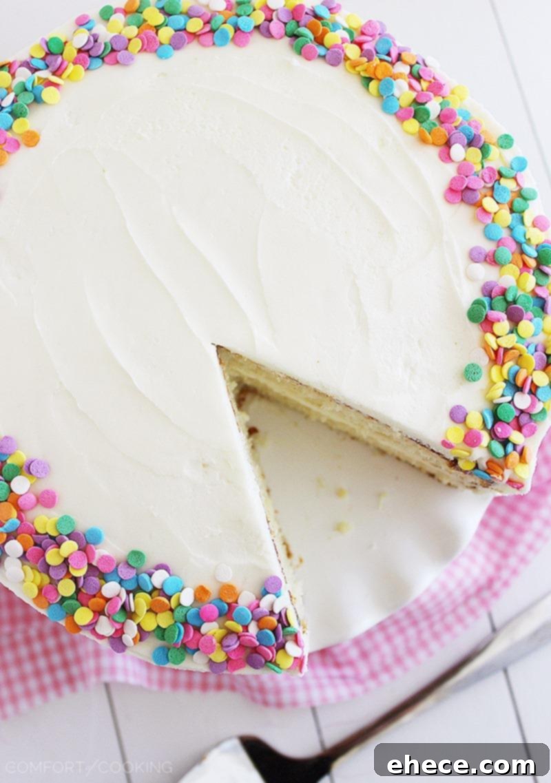 Close-up of a Slice of Fluffy Yellow Cake with Vanilla Frosting