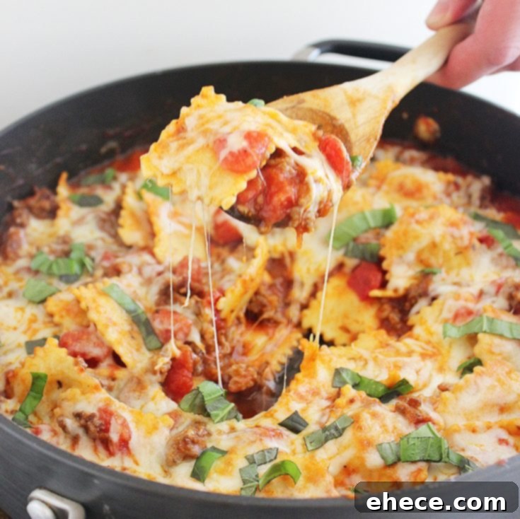 Pinterest Pin for Cheesy Ravioli and Italian Sausage Skillet