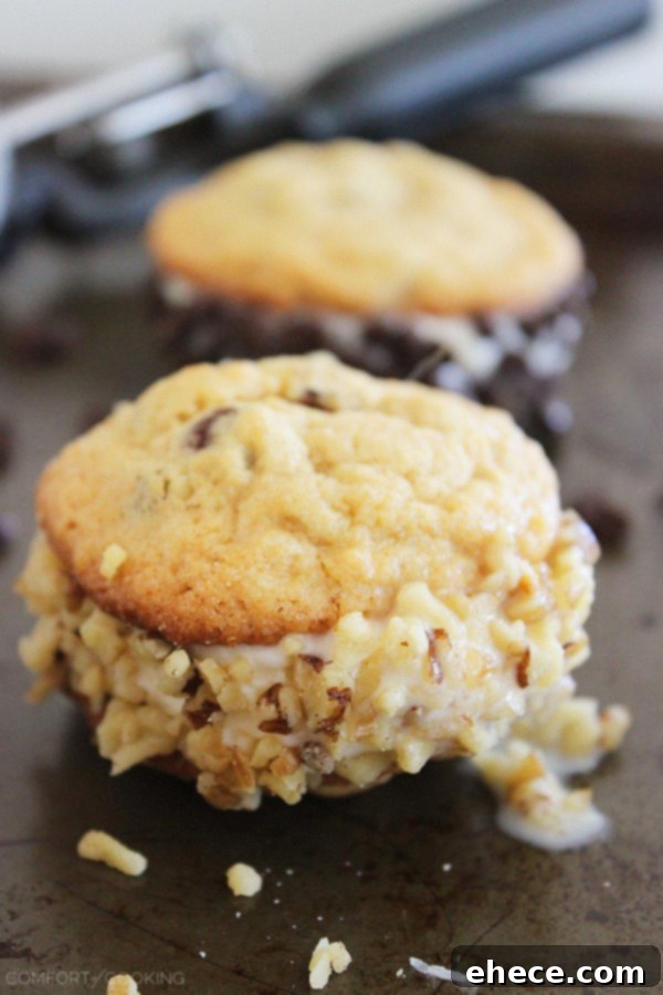 Stack of three irresistible homemade cookie ice cream sandwiches with various toppings.