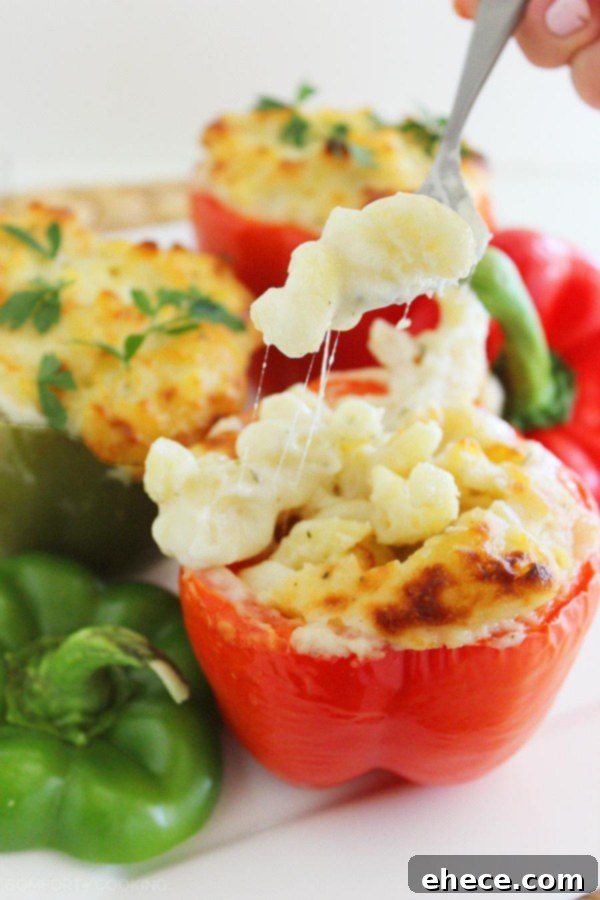 Italian Mac and Cheese Stuffed Peppers – Gooey, golden mac and cheese baked 'til bubbly in bell peppers makes a delicious, easy vegetarian side (or main meal)! | thecomfortofcooking.com