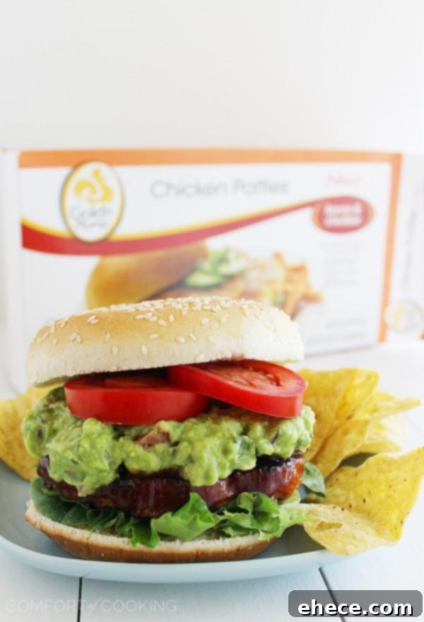 Delicious BBQ Bacon-Cheddar Chicken Burgers with Pineapple Guacamole, perfect for a healthy and easy meal. | thecomfortofcooking.com
