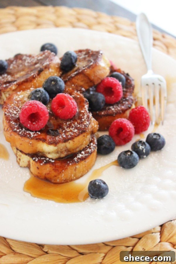 Cinnamon-Vanilla Mini French Toast with Berries – Soft, crisp French toast gets a mini makeover in this perfect weekend breakfast recipe. So good! | thecomfortofcooking.com