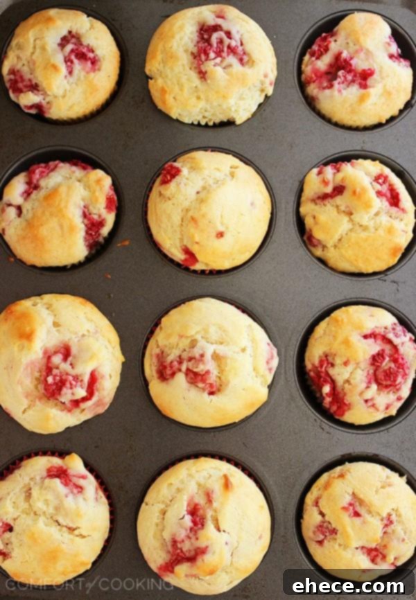 Super Soft Lemon-Raspberry Muffins – Wake up to a batch of these super soft, summery lemon raspberry muffins. They freeze and reheat easily, too! | thecomfortofcooking.com