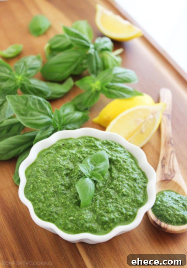 Vibrant Spinach Basil Pesto 2 Spinach Basil Pesto – This easy, nut-free pesto pairs perfectly with grilled meats and veggies, sandwiches, and pastas! | thecomfortofcooking.com