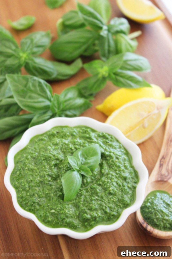Vibrant Spinach Basil Pesto 4 Spinach Basil Pesto – This easy, nut-free pesto pairs perfectly with grilled meats and veggies, sandwiches, and pastas! | thecomfortofcooking.com