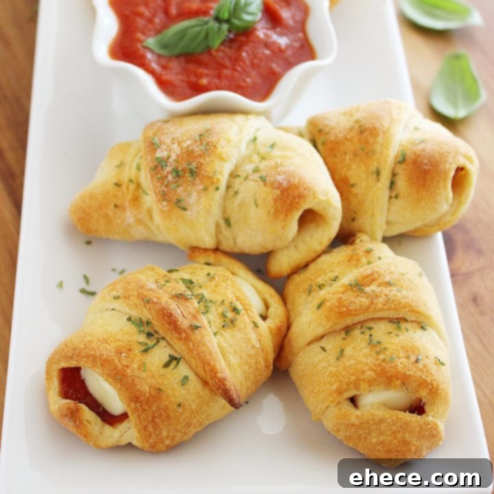 Pepperoni Pizza Crescent Bites 7 Pepperoni Pizza Crescent Rollups - Simple, cheesy, and quick to make, perfect for parties or weeknight dinners. (Recipe card image)