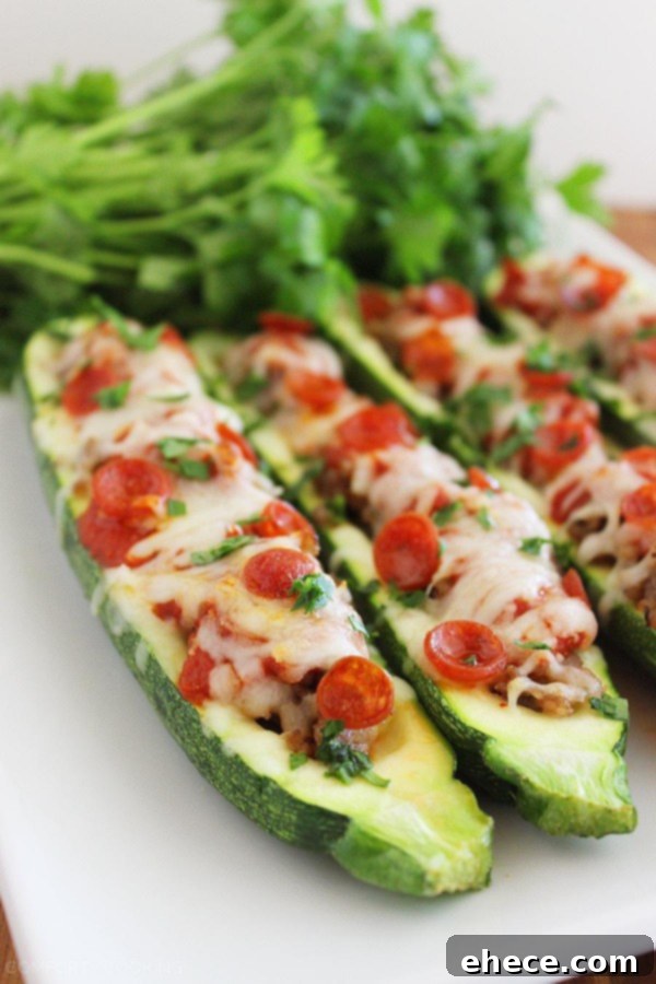 Zucchini Pizza Boats 5 A colorful array of baked Pizza Zucchini Boats topped with fresh parsley