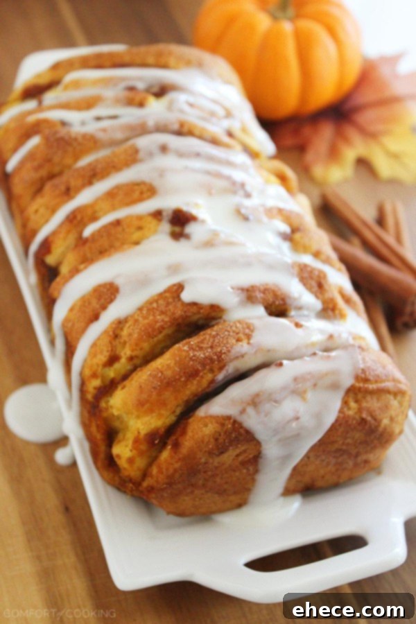 Warm Pumpkin Spice Pull-Apart Delight with Vanilla Glaze 2 Delicious Pumpkin Spice Pull Apart Bread with Sweet Vanilla Glaze for a perfect fall breakfast or dessert