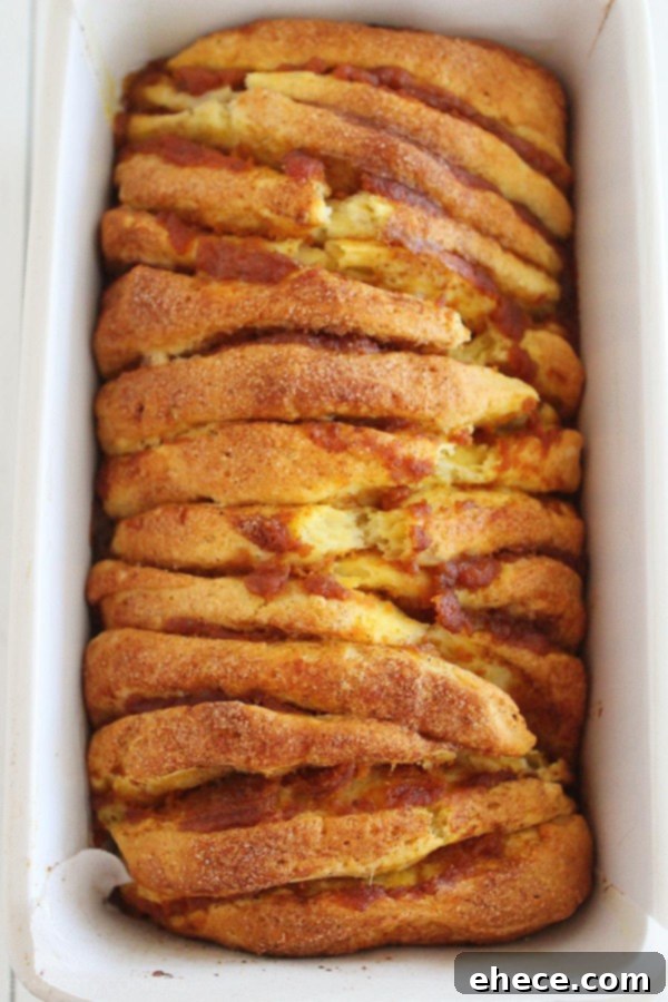 Spiced Pumpkin Pull-Apart Bread with Creamy Vanilla Glaze 4 Pumpkin Spice Pull Apart Bread with Vanilla Glaze – Every layer is full of soft, gooey goodness and tastes just like a cinnamon roll (made MUCH simpler). | thecomfortofcooking.com