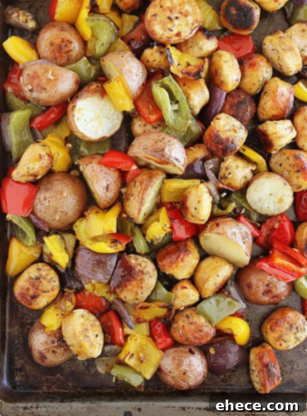 Up-close shot highlighting the golden-brown chicken sausage pieces nestled among tender potatoes and bell peppers.