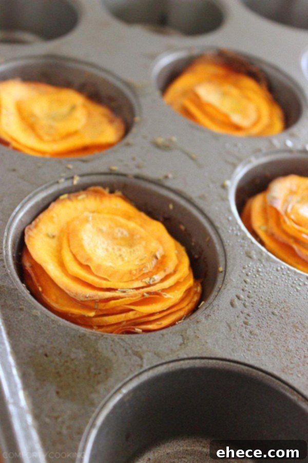 Sweet potato slices coated with butter, Parmesan, and rosemary