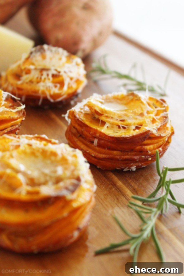 Muffin tin filled with layered sweet potato stacks before baking