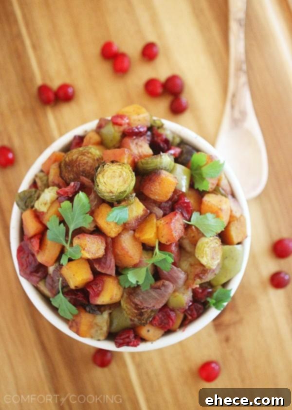 Roasted vegetables and fruits in a pan, showcasing the delicious caramelization and colors.