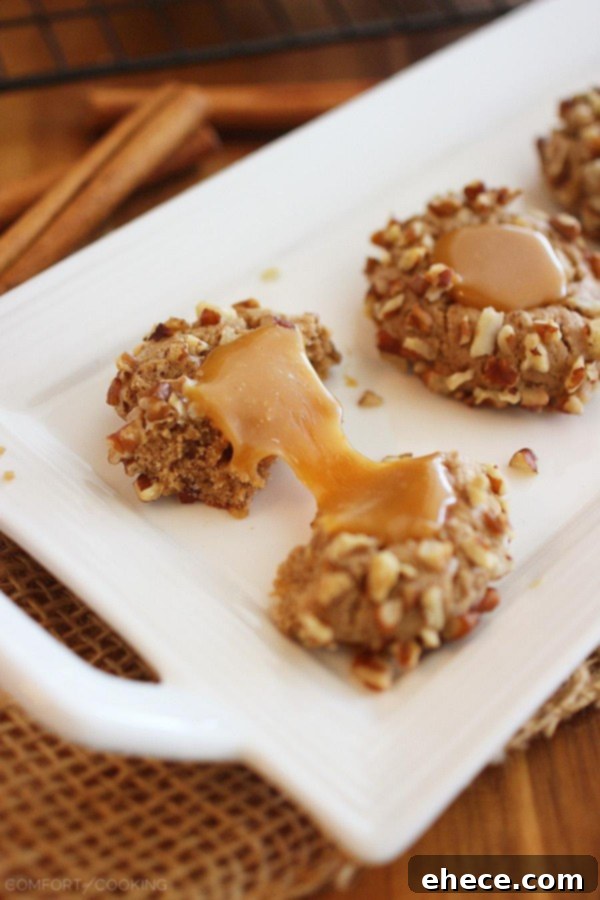 Delicious Caramel Spice Thumbprint Cookies arranged beautifully, highlighting the golden caramel and pecan crust – perfect for holiday entertaining.
